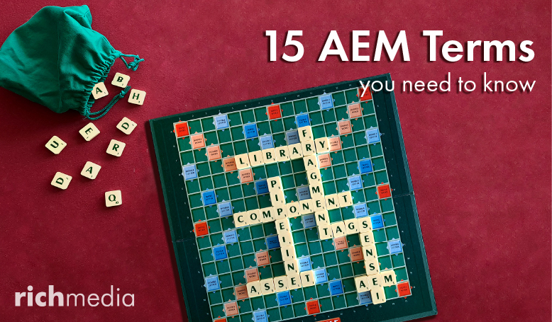 photograph of a Scrabble board with letters arranged to form content management system terms; text reads “15 AEM Terms You Need to Know”